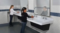 girls washing their hands in a commercial restroom girls washing their hands in a commercial restroom