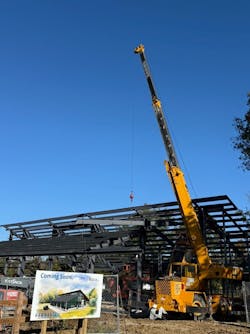The placement of the final structural beam. Note the artist conception in the foreground. The placement of the final structural beam. Note the artist conception in the foreground.