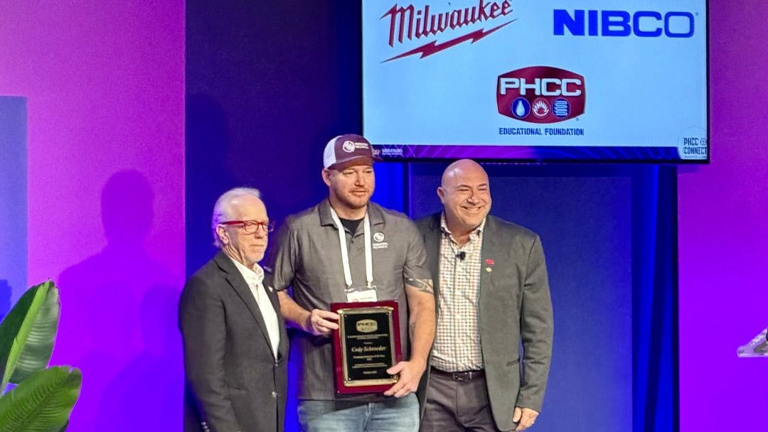 Cody Schroeder receives his award for Plumbing Instructor of the Year at PHCC Connect 2025.