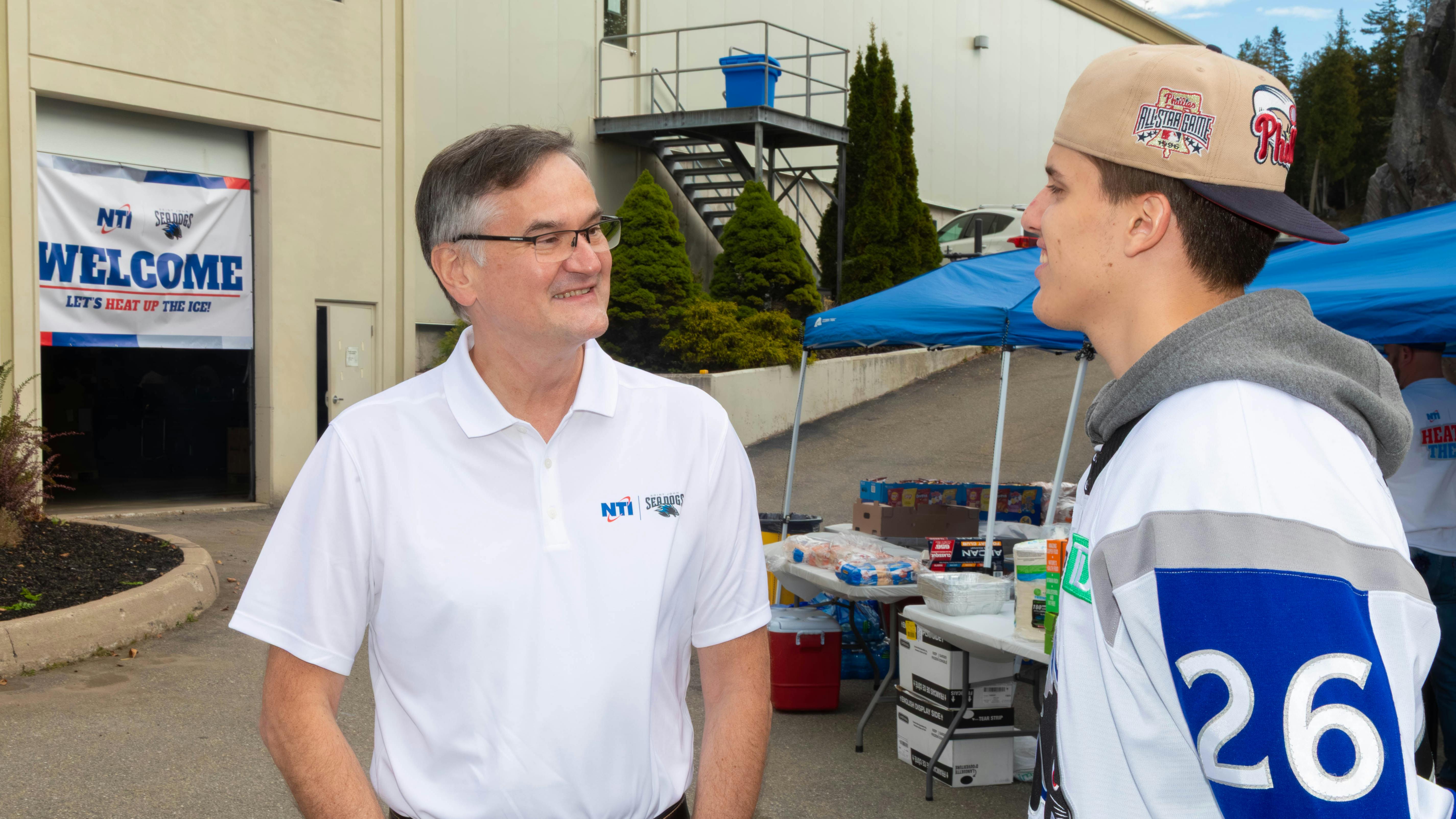NTI President Grzegorz Wojcik talks with Patryk Zubek of the Saint John Sea Dogs.