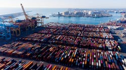 Aerial view of shipping containers and cargo ships in the sea port of Barcelona in Spain, Europe. Aerial view of shipping containers and cargo ships in the sea port of Barcelona in Spain, Europe.
