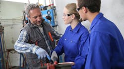 Plumbing students with instructor. Plumbing students with instructor.