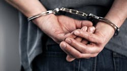 Man in handcuffs. Man in handcuffs.