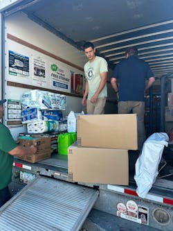 Plumbing Outfitters team members bringing relief to flood victims. Plumbing Outfitters team members bringing relief to flood victims.