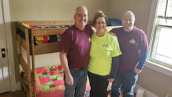 Rasmussen volunteers with a newly-assmbled bed. Rasmussen volunteers with a newly-assmbled bed.