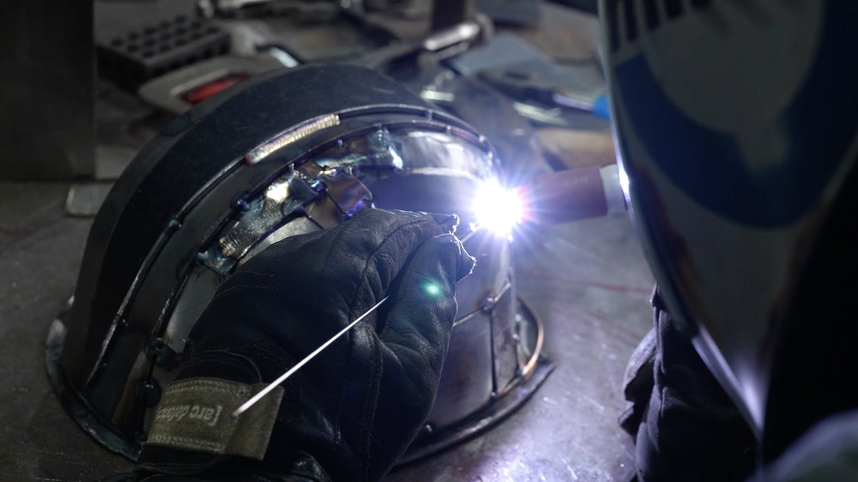 A fully welded metal hard hat created by Detroit artist Josh Welton of Brown Dog Welding.