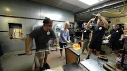 April Wagner of Epiphany Studios (center) creating a hard hat sculpted entirely from glass. April Wagner of Epiphany Studios (center) creating a hard hat sculpted entirely from glass.