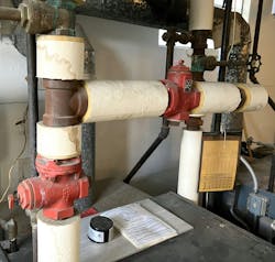 The valve on the left is connected to the supply tapping of the boiler, so water can only go up through the valve. The valve on the right is connected to a tee in the return line of the boiler. The valve on the left is connected to the supply tapping of the boiler, so water can only go up through the valve. The valve on the right is connected to a tee in the return line of the boiler.