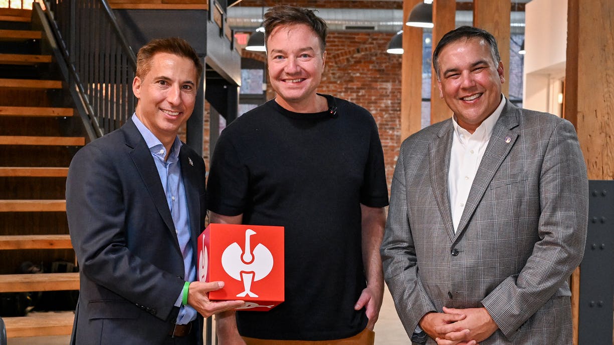 STRAUSS CEO Henning Strauss (center), Columbus Mayor Andrew Ginther (right), and Columbus Partnership CEO Jason Hall (left).