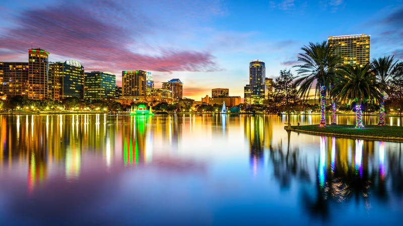 Orlando, Florida, USA downtown city skyline on Eola Lake.