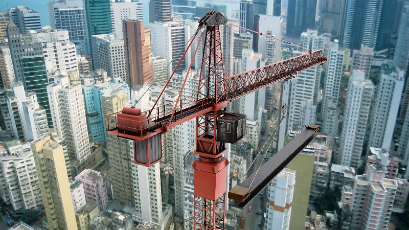 View of a construction crane from above looking down onto a metropolitain city scape