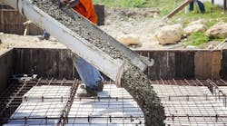 Pouring the concrete foundation of a house. Pouring the concrete foundation of a house.