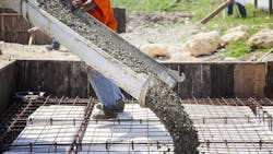 Pouring the concrete foundation of a house. Pouring the concrete foundation of a house.