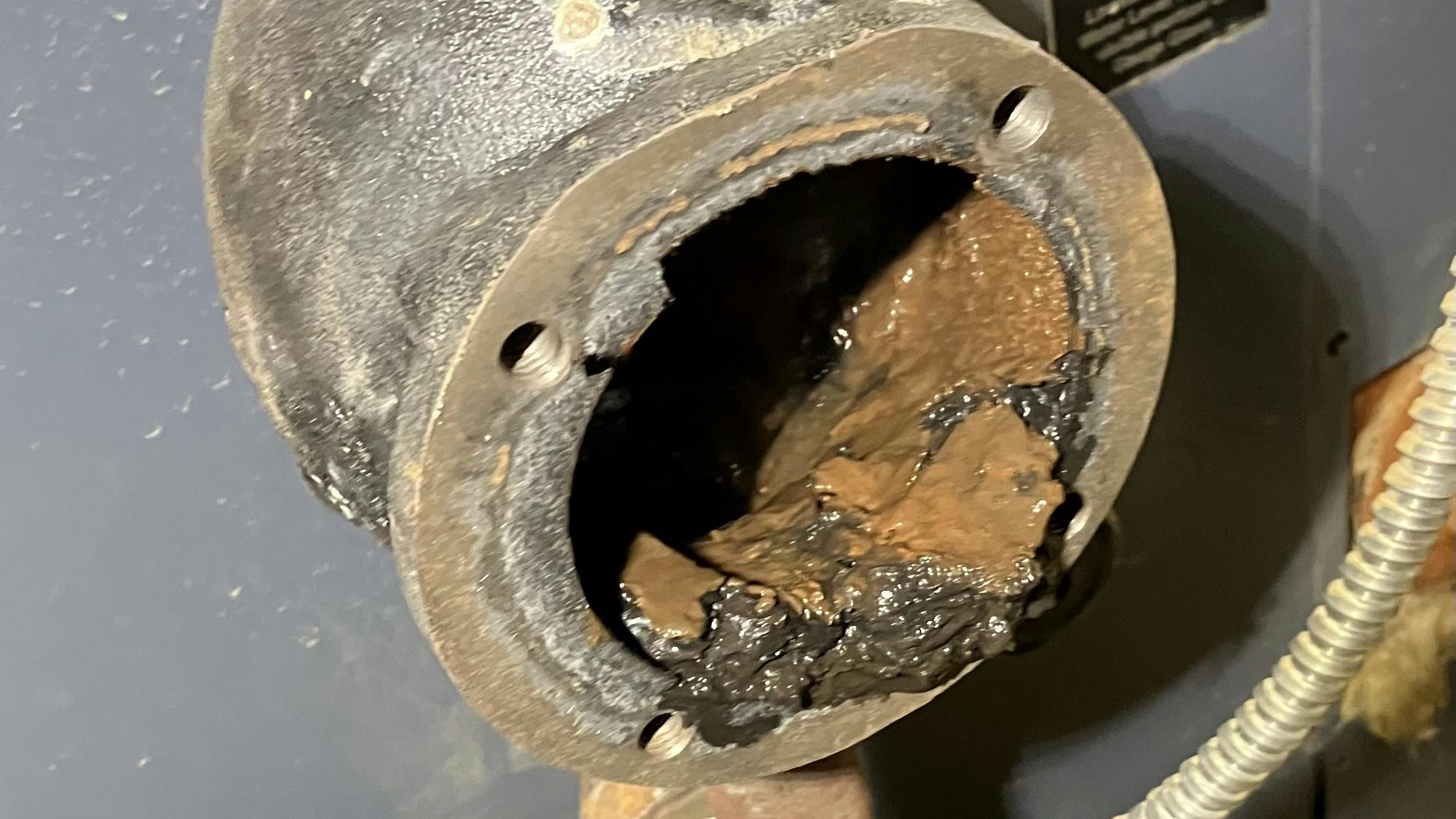 This clogged control is a float-type low water cutoff, a float mounted outside the boiler heat exchanger that senses how much water is in the boiler.