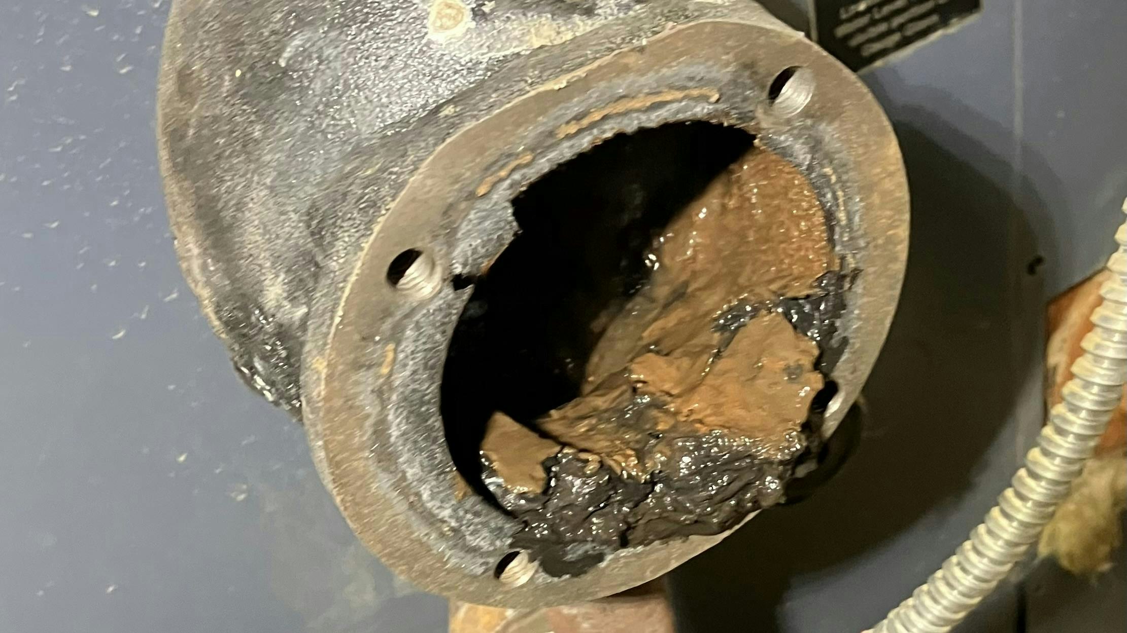 This clogged control is a float-type low water cutoff, a float mounted outside the boiler heat exchanger that senses how much water is in the boiler.