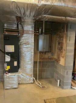 An after shot of the mechanical room, with the Rinnai RX tankless unit, Taco Hydro Air Fan Controller and a Taco 0011 circ pump. An after shot of the mechanical room, with the Rinnai RX tankless unit, Taco Hydro Air Fan Controller and a Taco 0011 circ pump.
