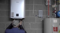 Ther Rinnai tankless unit being installed. Ther Rinnai tankless unit being installed.