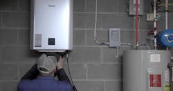 Ther Rinnai tankless unit being installed. Ther Rinnai tankless unit being installed.