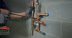 Installing a section of the Heat Pump Helper piping. Installing a section of the Heat Pump Helper piping.