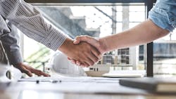 Handshake business deal contractor's office Handshake business deal contractor's office