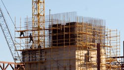 Construction workers climbed on scaffolding. Construction workers climbed on scaffolding.