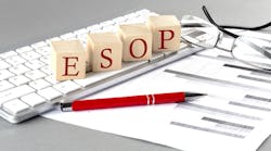 ESOP written on a wooden cube on the keyboard with chart on grey background ESOP written on a wooden cube on the keyboard with chart on grey background