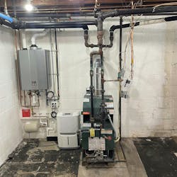 Before: the cast iron boiler that was servicing the house had been in place for 30 years, was inefficient and took up significant basement space. Before: the cast iron boiler that was servicing the house had been in place for 30 years, was inefficient and took up significant basement space.