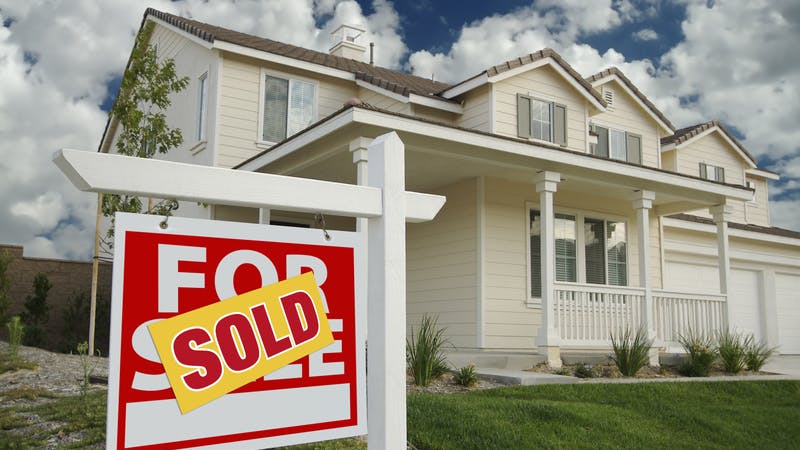 For Sale Sign and House.