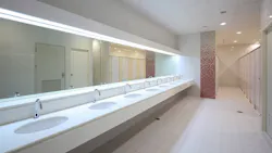 Line of sinks in a commercial restroom. Line of sinks in a commercial restroom.