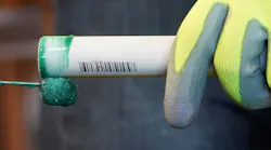 applying solvent cement to a CPVC pipe section applying solvent cement to a CPVC pipe section