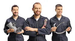 Team of plumbers holding plumbing equipment Team of plumbers holding plumbing equipment