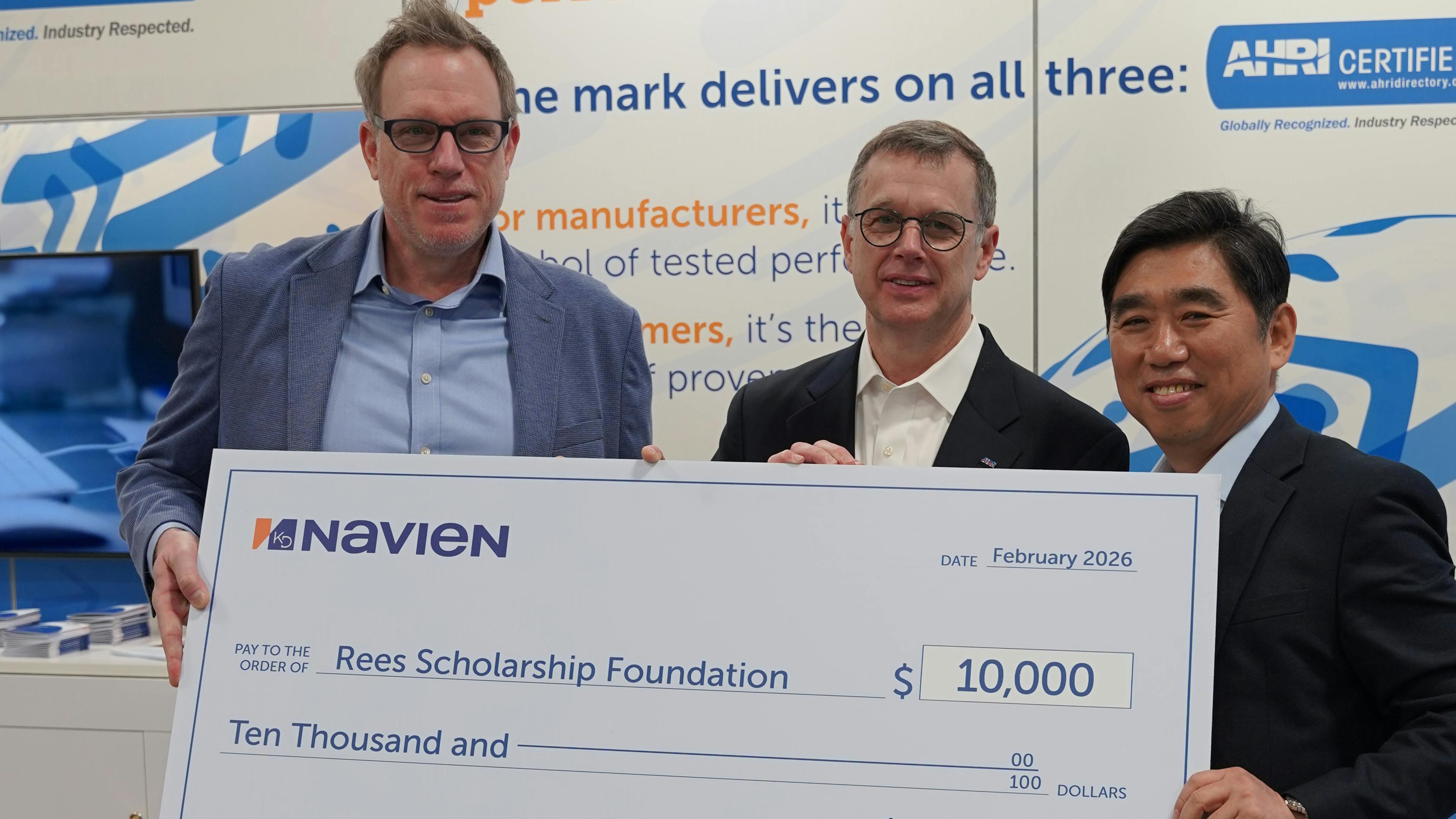 Navien COO Dareen Sheehan (left) and CEO TH Kim (right) Present Donation to AHRI President and CEO Steve Yurek (middle).