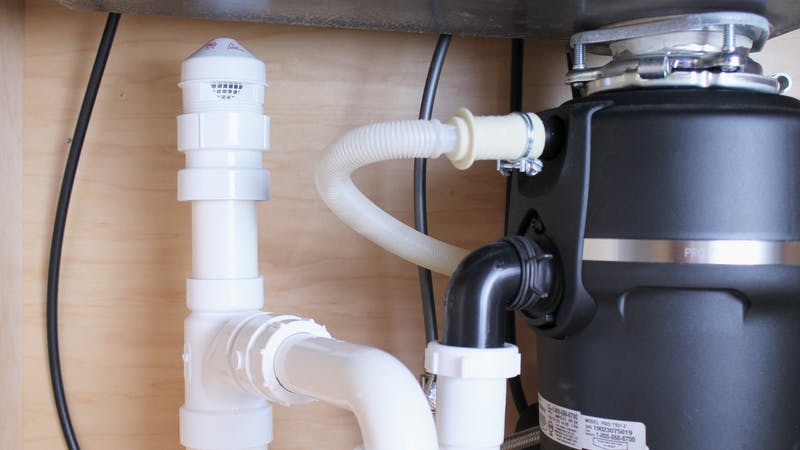 An installed AAV under a residential sink.