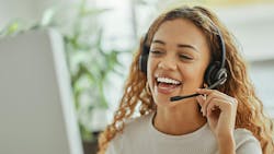 Customer service rep taking a call. Customer service rep taking a call.