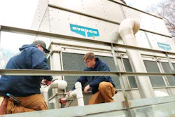 Kyle Knotts (Mechanic) and Logan Cook (Apprentice) perform a service check on an EVAPCO AT dual-cell, induced draft, counterflow EVAPCO cooling tower. Kyle Knotts (Mechanic) and Logan Cook (Apprentice) perform a service check on an EVAPCO AT dual-cell, induced draft, counterflow EVAPCO cooling tower.