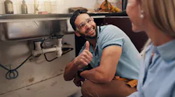 plumber with satisfied customer plumber with satisfied customer