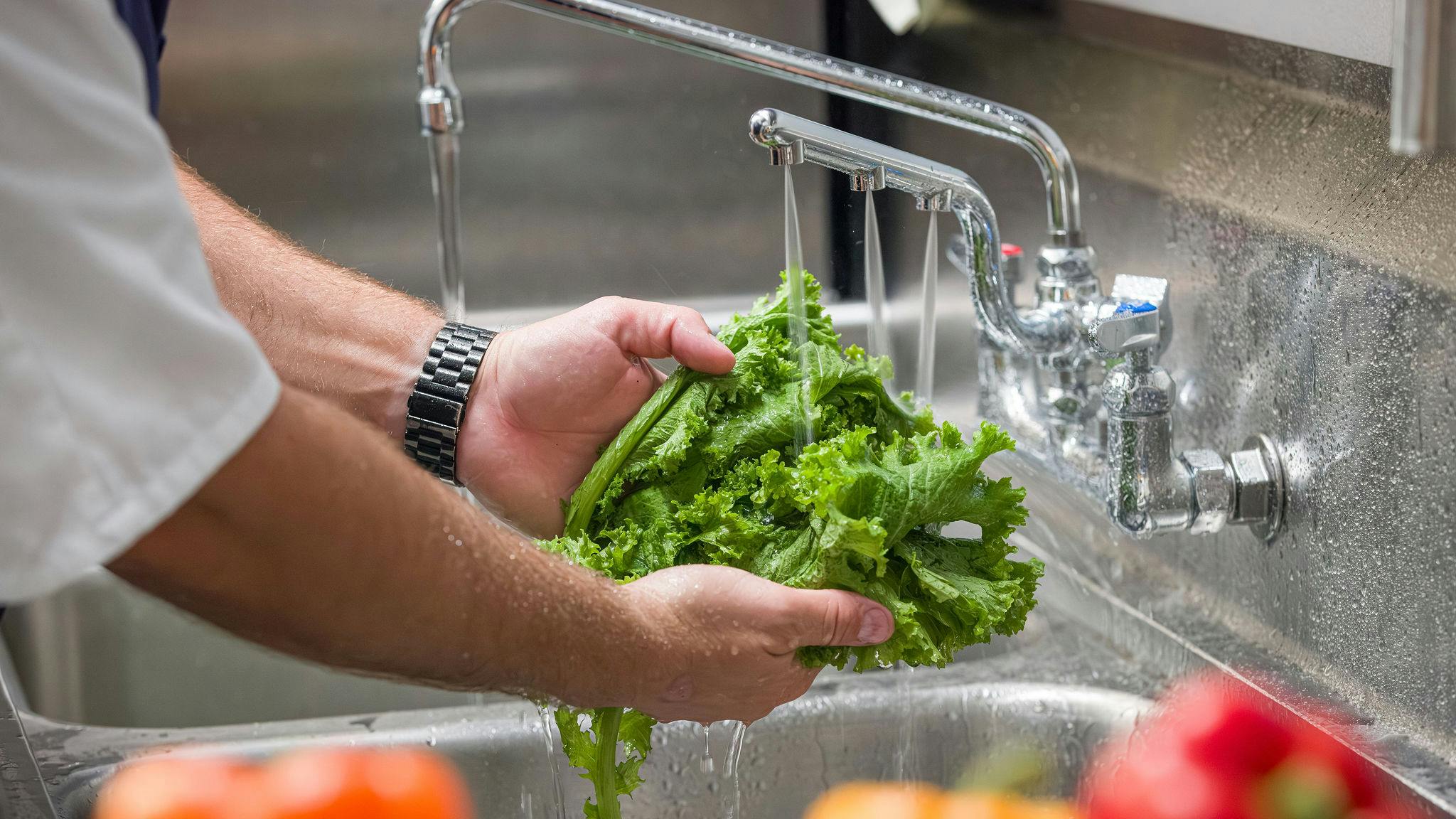 view of a sink in a commercial kitchen
