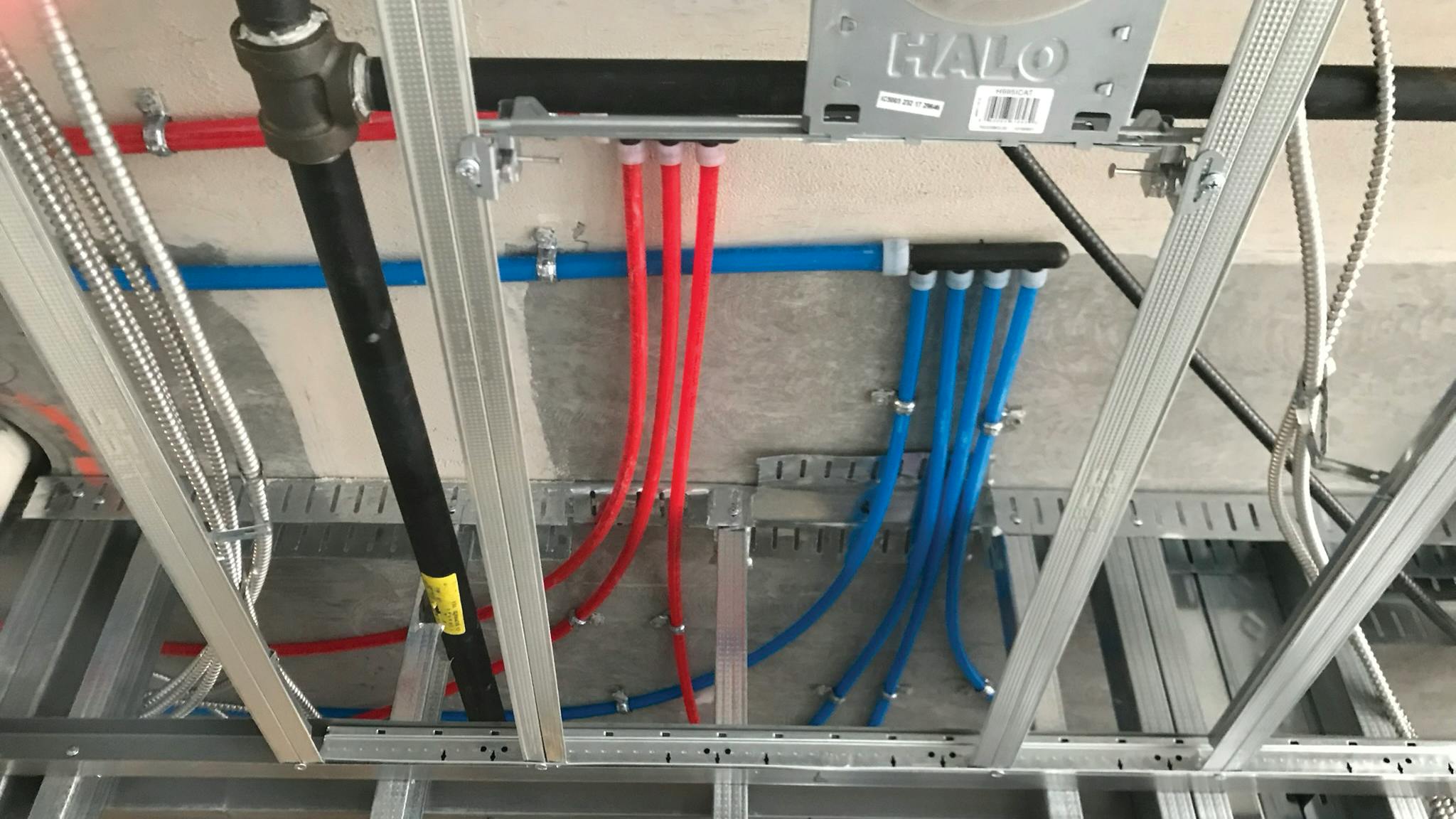 Uponor AquaPEX pipe and ProPEX multiport tee.