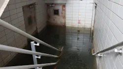 Flooded Basement with Deep Murky Water and Rusty Doors Flooded Basement with Deep Murky Water and Rusty Doors