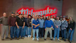 Workshop attendees pose for a picture in front of the logo of host and sponsor Milwaukee Tool. Workshop attendees pose for a picture in front of the logo of host and sponsor Milwaukee Tool.