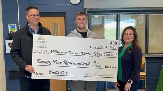 Ferguson presents a $25,000 donation to Skills Lab.