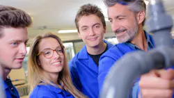 A group of plumbing students with teacher. A group of plumbing students with teacher.