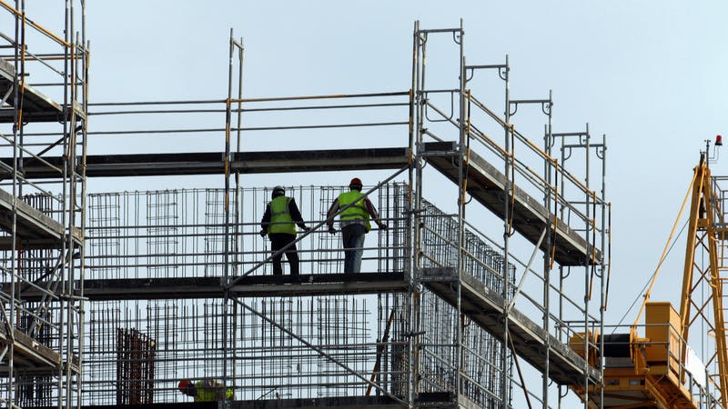 Construction workers in new building of the city