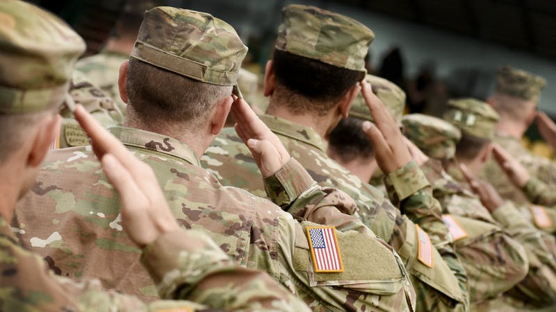 US soldiers salute.