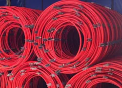 Pre-piped coils of RAUMAT delivered to the installation site. Pre-piped coils of RAUMAT delivered to the installation site.