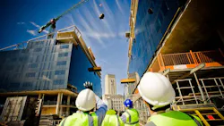 Building under construction with workers. Building under construction with workers.