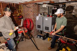 Hunter Bailey (left), lead apprentice, and Daniel McCorkendale, plumber, pipe the basement mechanical room. Hunter Bailey (left), lead apprentice, and Daniel McCorkendale, plumber, pipe the basement mechanical room.