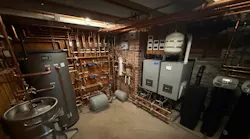 The basement mechanical room, complete with two ALTA boilers, a 120-gallon indirect tank and (lower left corner) a beer keg urinal.