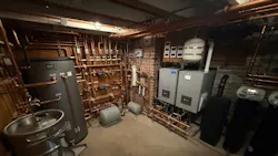 The basement mechanical room, complete with two ALTA boilers, a 120-gallon indirect tank and (lower left corner) a beer keg urinal. The basement mechanical room, complete with two ALTA boilers, a 120-gallon indirect tank and (lower left corner) a beer keg urinal.