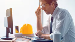 Construction engineer working on desktop computer